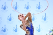 Гимнастка во время упражнения с обручем на всероссийском турнире «Кубок "Небесная грация"»